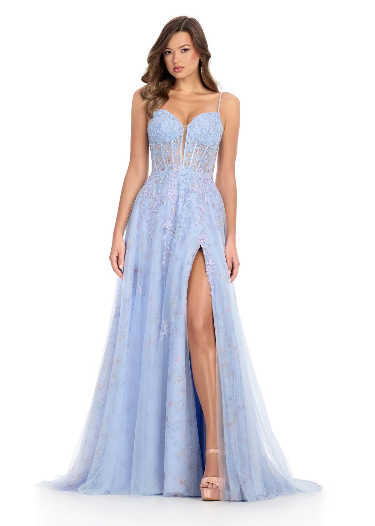Elegant spaghetti strap evening gown featuring a structured corset bodice with floral embroidery, flowing tulle skirt with thigh-high slit, and a romantic design.