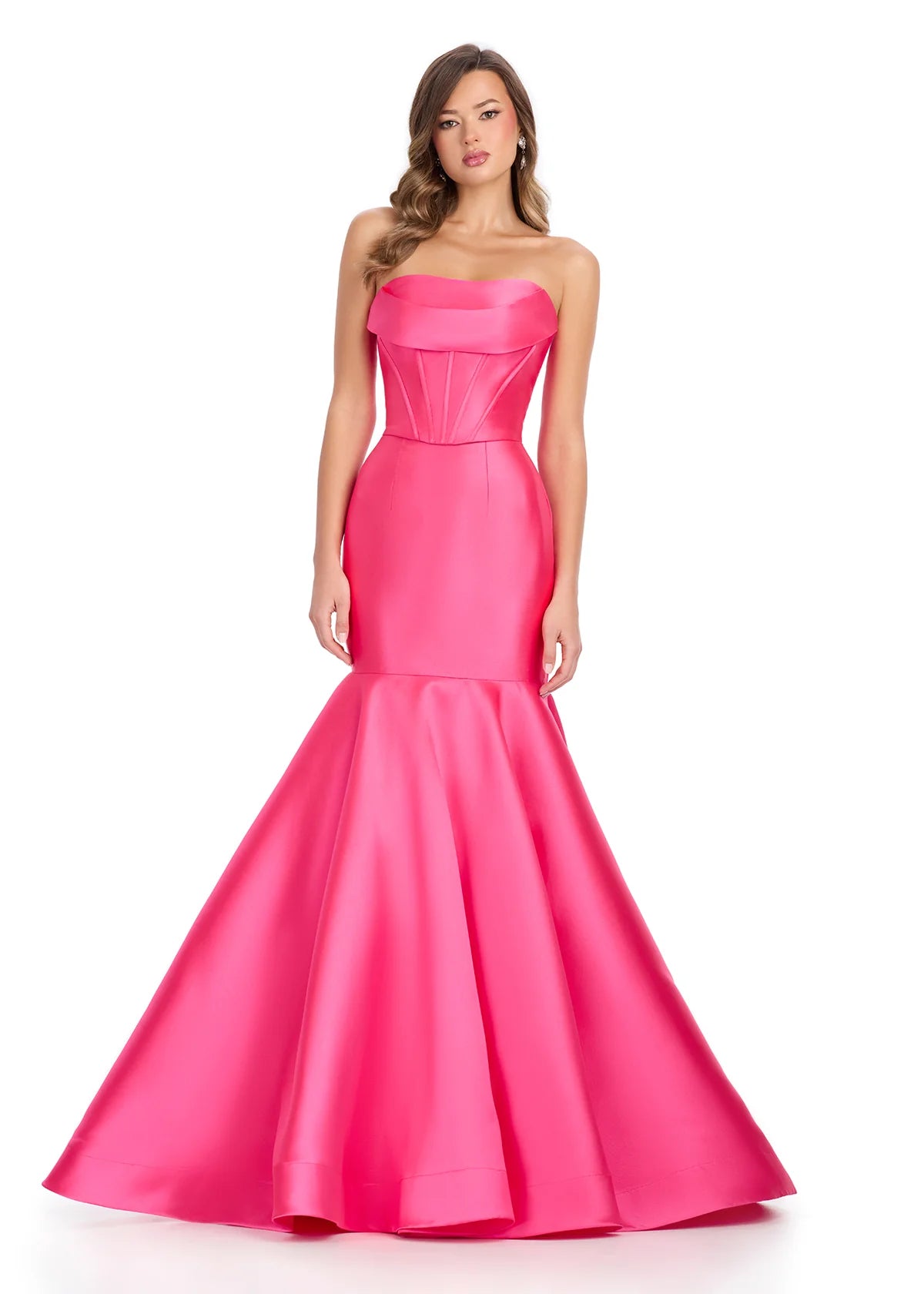 Strapless Pink Mermaid Gown Featuring A Satin Corset Bodice And Dramatic Flared Skirt.