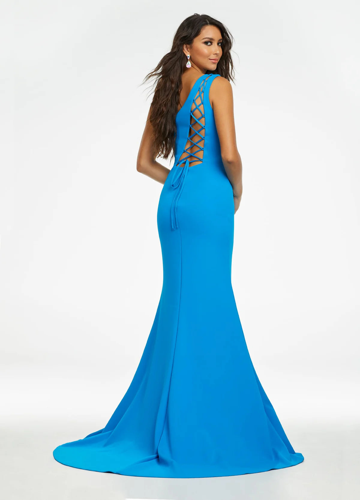 Back View - One-shoulder royal blue gown with a fitted silhouette, high slit, and floor-length design.