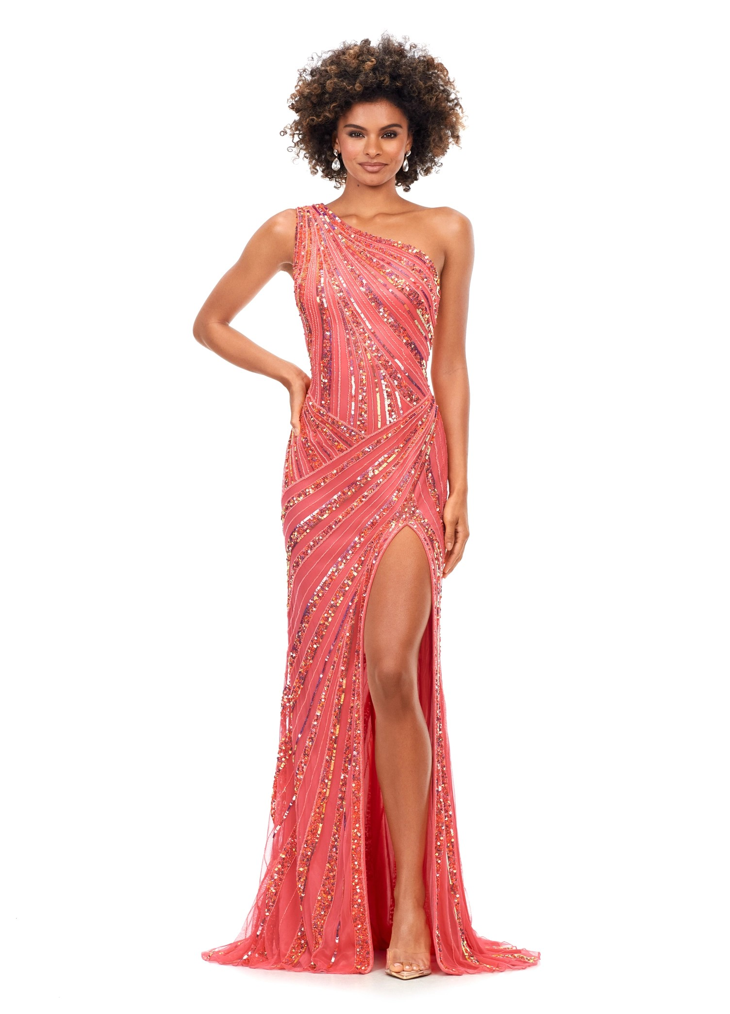Stunning coral one-shoulder gown embellished with intricate sequins, offering a high slit for a glamorous finish.