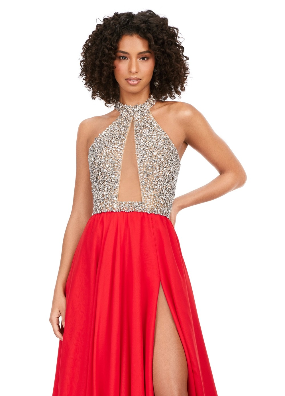 Halter-neck gown featuring a sparkling embellished bodice with a keyhole cut-out, flowing into a soft, red, sheer A-line skirt with a thigh-high slit, offering an elegant and ethereal look.
