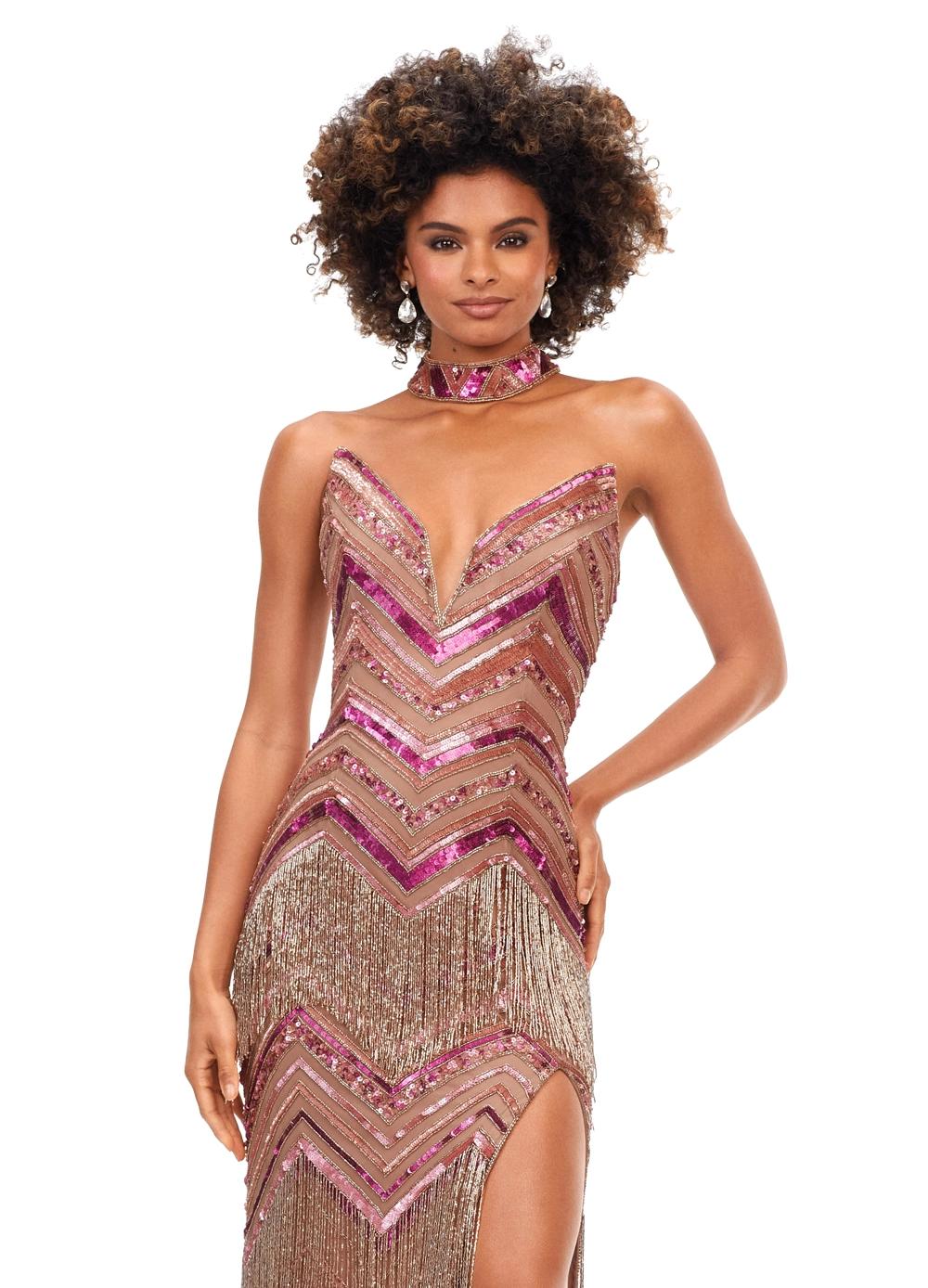 Eye-catching bronze and pink floor-length gown featuring a plunging neckline, chevron beadwork, fringe detailing, a matching choker, and a thigh-high slit for a bold and glamorous look.