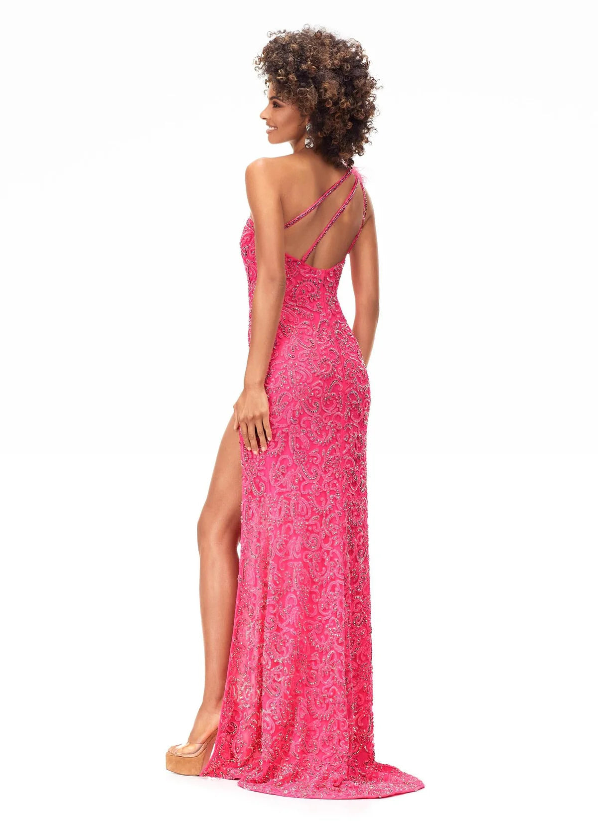 Back view - Stunning pink one-shoulder evening gown with intricate beadwork, feathered shoulder detail, and a thigh-high slit for a bold and glamorous look.