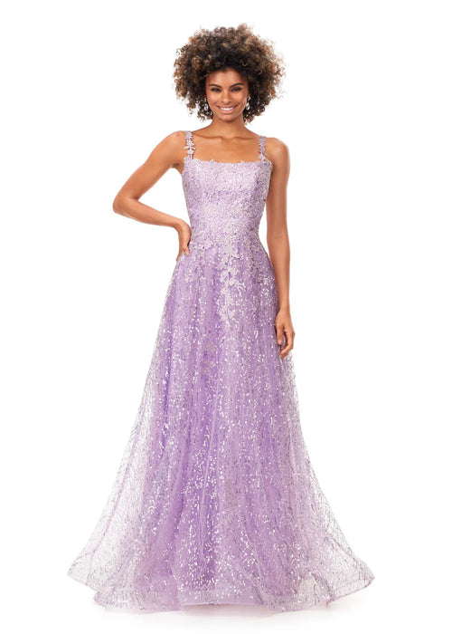 Remi Gown | Lilac A-line gown adorned with delicate floral lace and shimmering sequins, featuring a square neckline and a softly flowing silhouette for a timeless and elegant look.