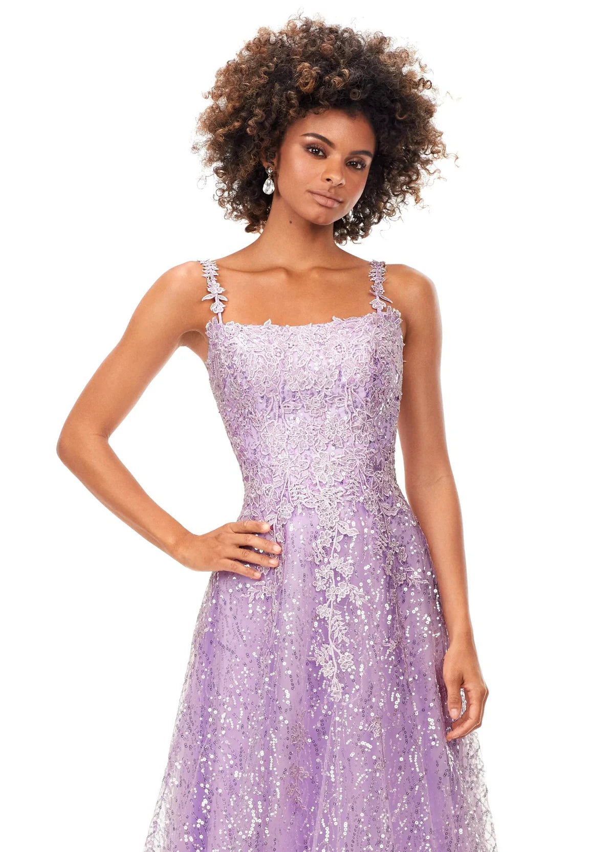 Lilac A-line gown adorned with delicate floral lace and shimmering sequins, featuring a square neckline and a softly flowing silhouette, perfect for a timeless and elegant look.