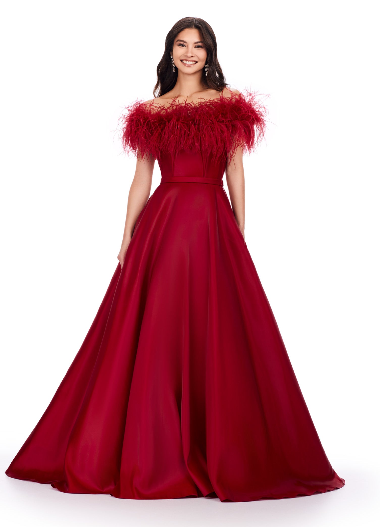 Elegant red ball gown featuring an off-the-shoulder feathered neckline and a flowing satin skirt for a timelessly dramatic look.