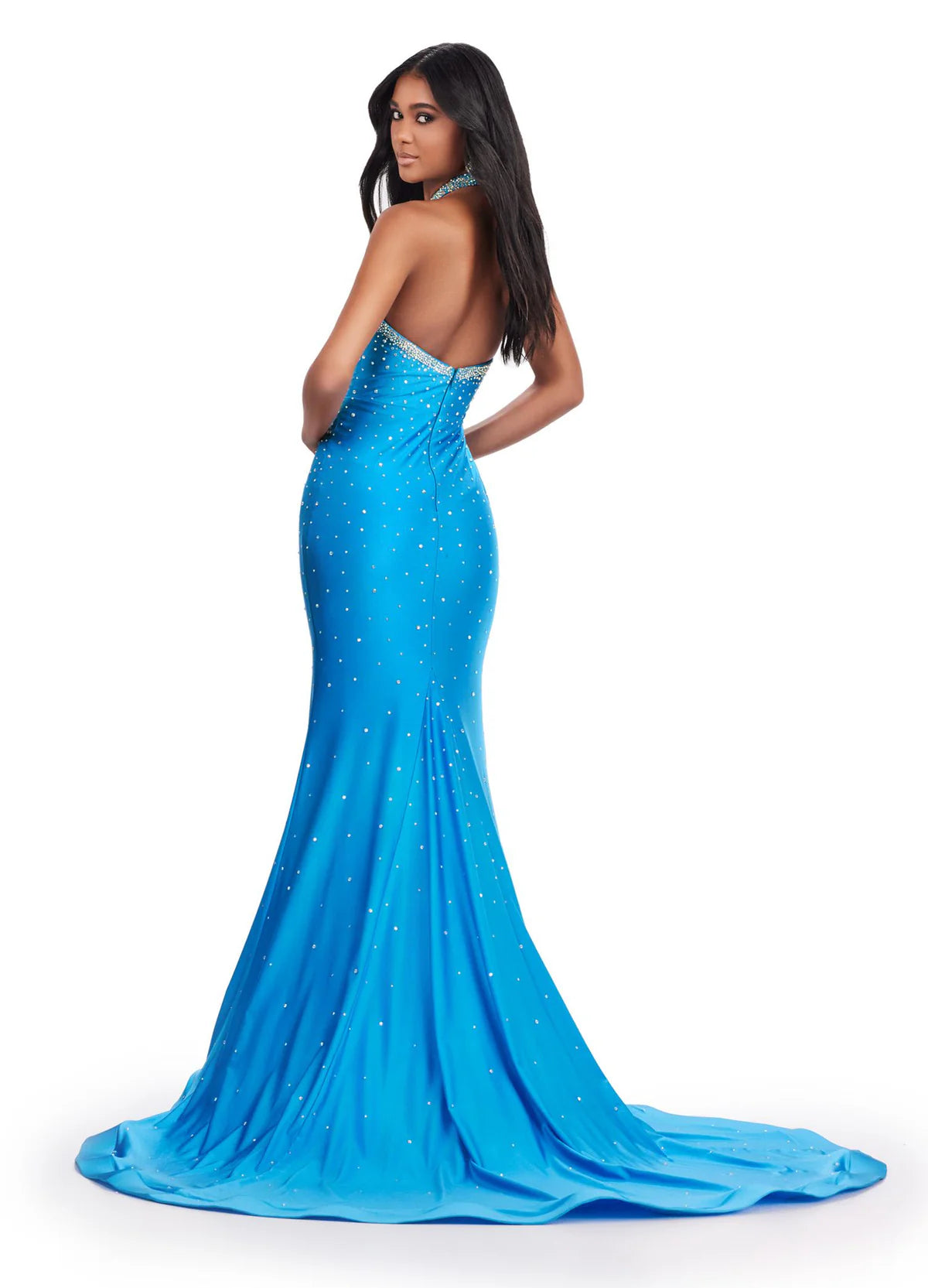 Back view of an elegant blue gown with a halter neckline, diamond-shaped cut-outs, and shimmering embellishments for a bold and glamorous statement.