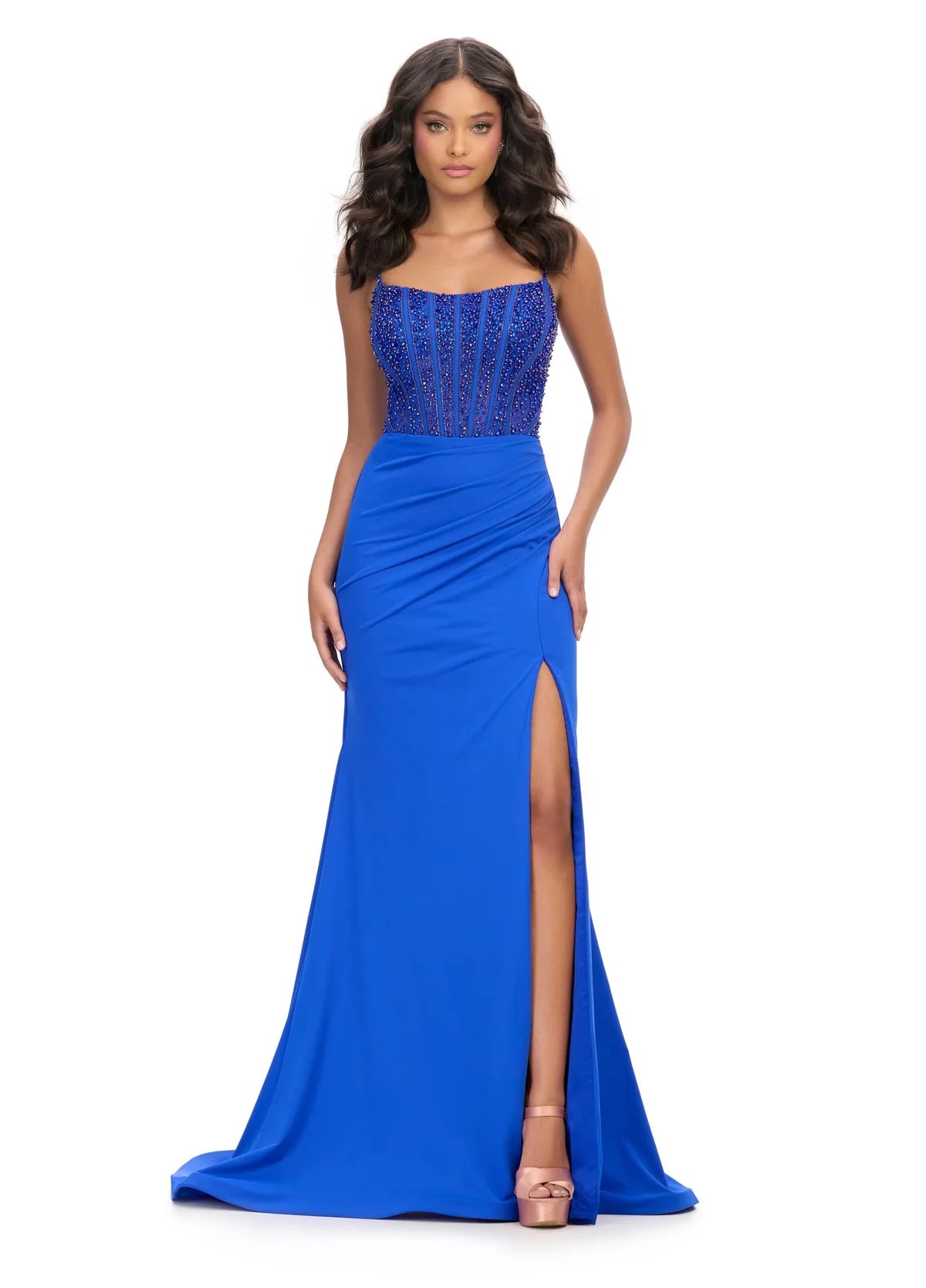 Royal Blue Evening Gown Featuring A Beaded Corset Bodice, Draped Skirt, Spaghetti Straps, And High Side Slit.