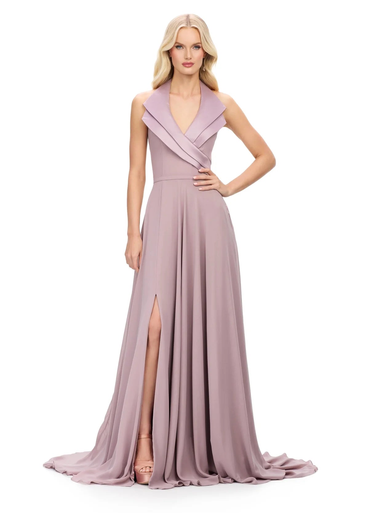 Halter-neck evening gown featuring a deep V-neckline with structured lapel detailing, a fitted waist, and a flowing floor-length skirt with a high slit.