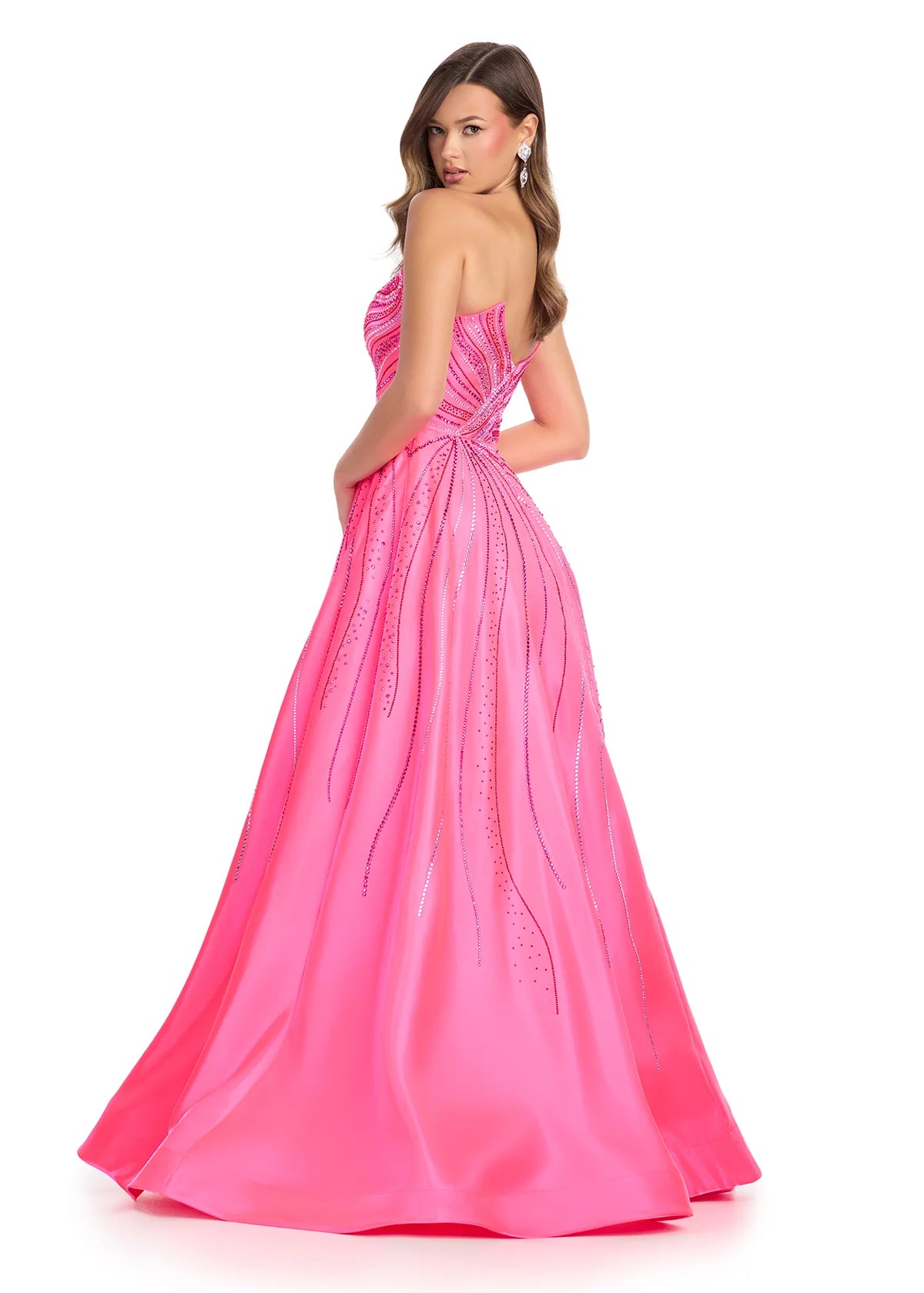 Back view - Strapless Hot Pink Ball Gown With Embellished Bodice And Flowing Skirt Featuring Subtle Crystal Detailing
