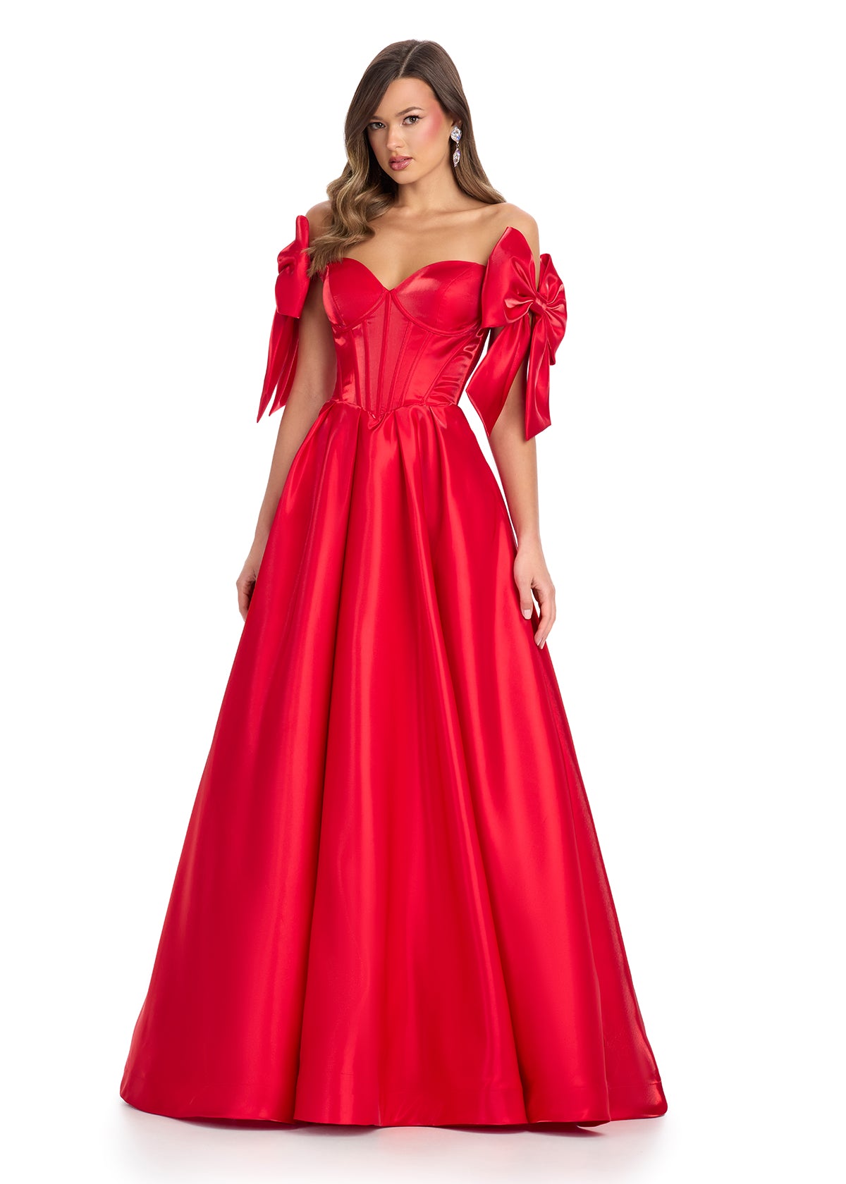 Red satin ball gown with a structured corset bodice, sweetheart neckline, and white bow-accented off-shoulder sleeves.