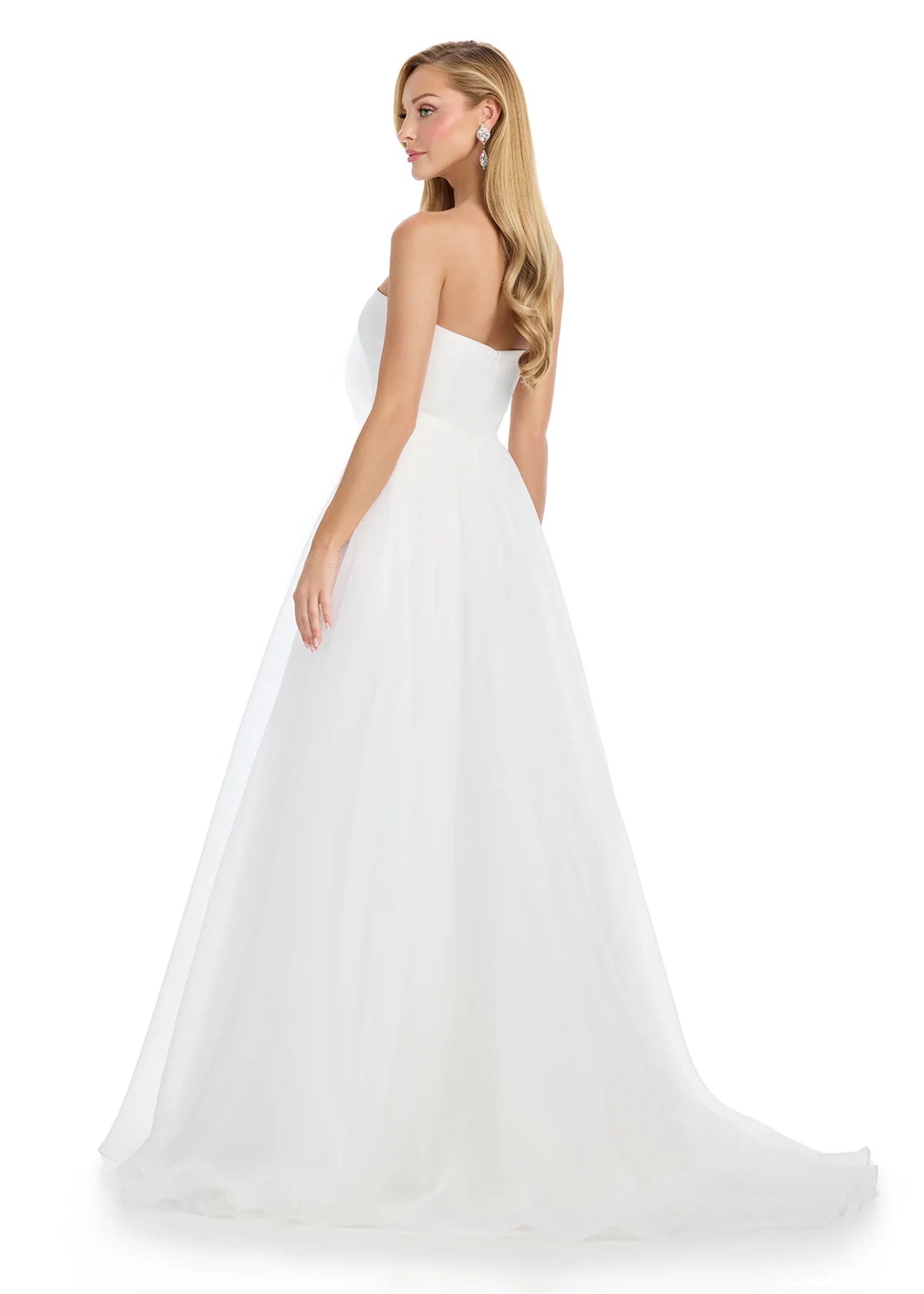 Back View - Strapless ivory gown with a large rose detail on the bodice and a flowing A-line silhouette.