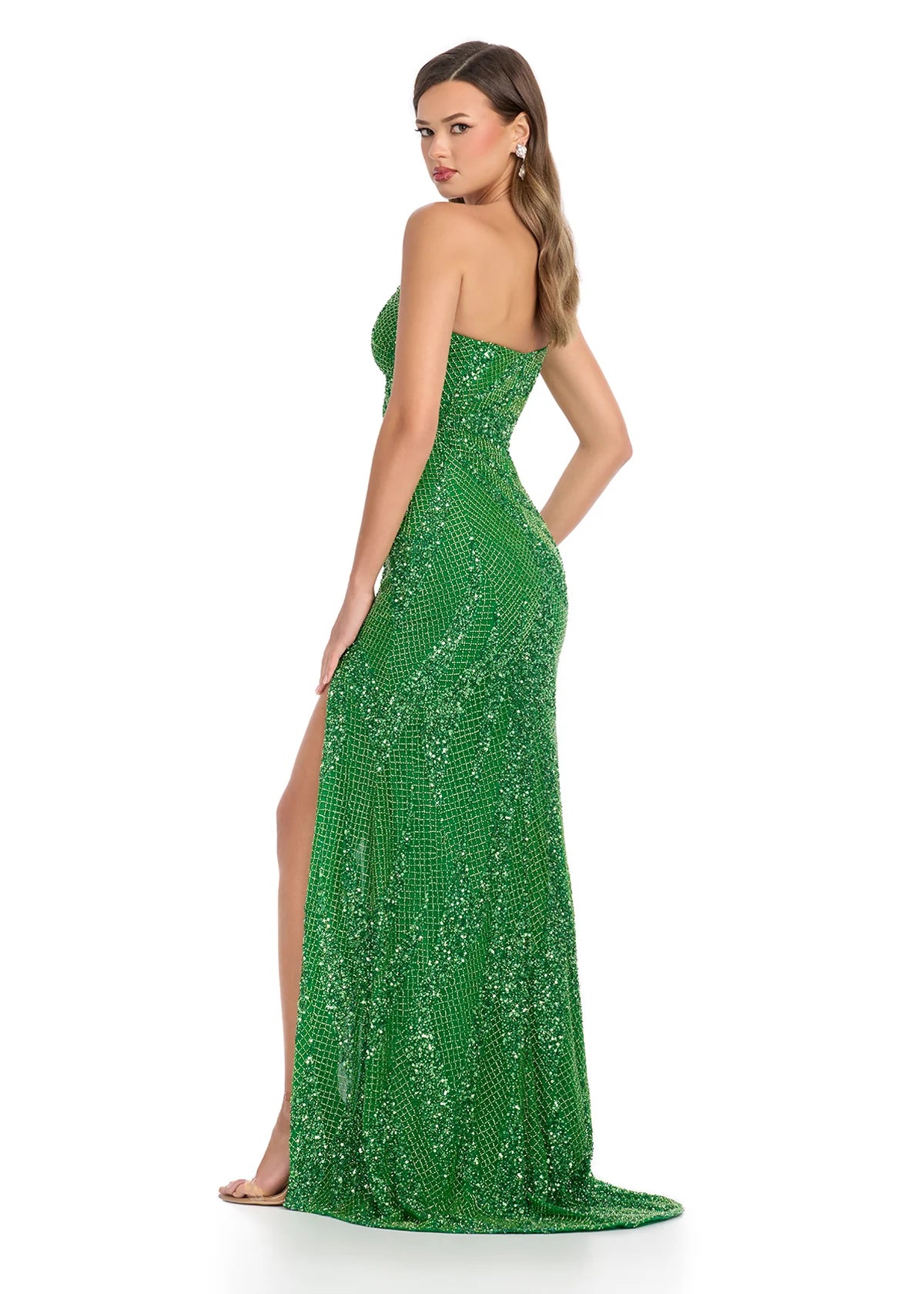 Back view - Lime green one-shoulder gown adorned with shimmering sequins, featuring a daring side slit and a geometric cut-out for a bold and elegant statement.
