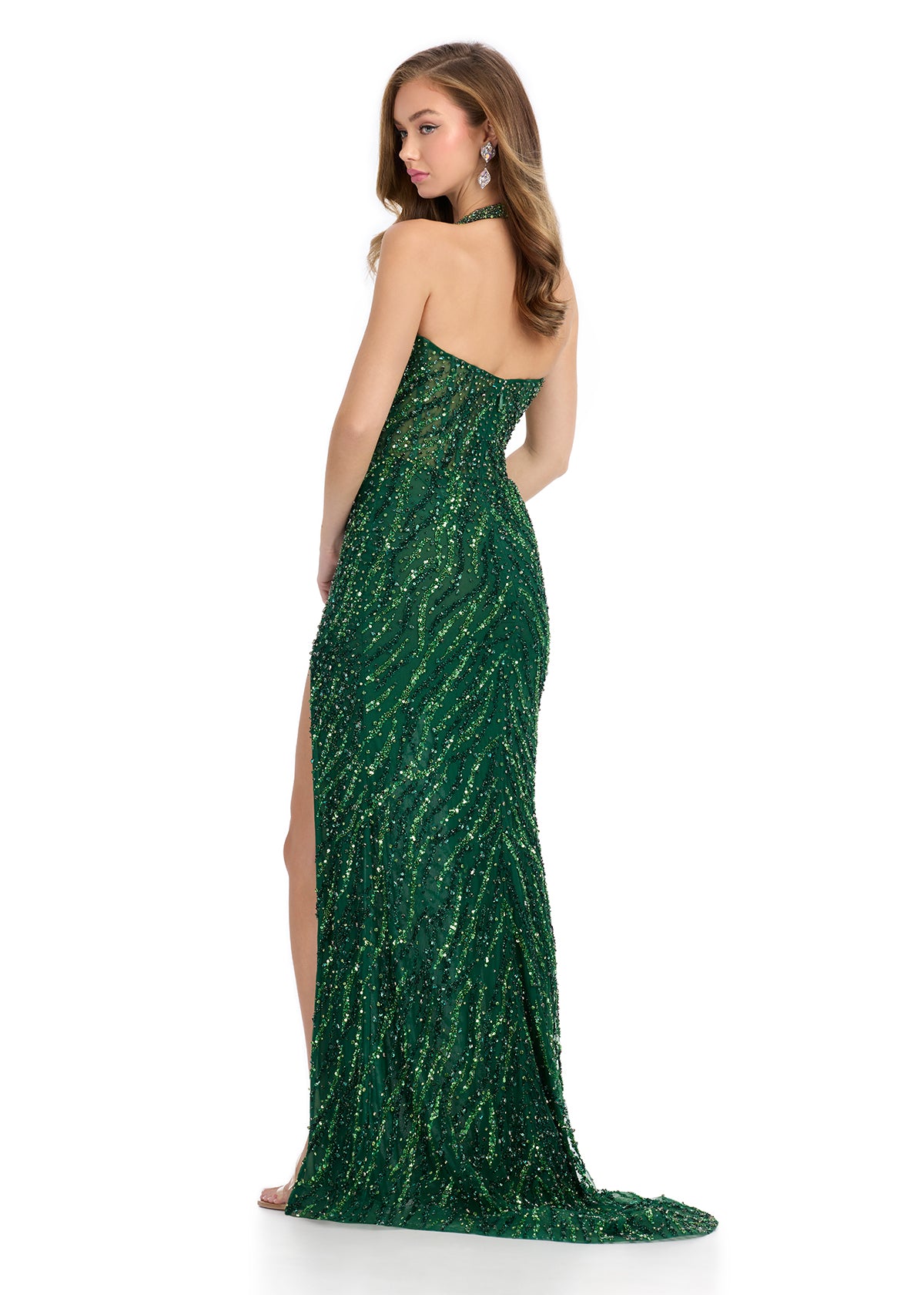 Back view - Emerald beaded halter gown featuring a plunging neckline, high leg slit, and intricate swirling embellishments, perfect for creating a bold and glamorous statement.