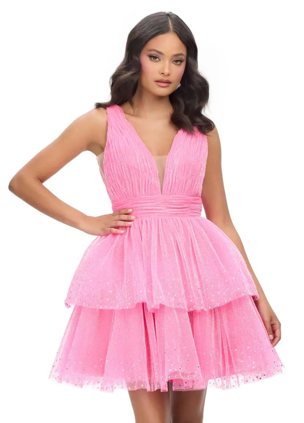 Pink tiered mini dress featuring a plunging V-neckline, delicate tulle layers with sparkling accents, and a cinched waist for a fairytale-inspired look.