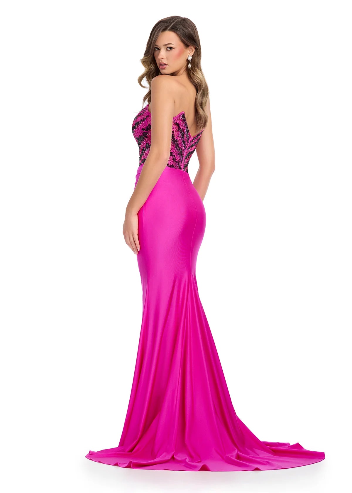 Hot Pink Strapless Evening Gown Featuring A Beaded Bodice With Chevron Detailing, Draped Skirt, High Side Slit, And Flowing Train 