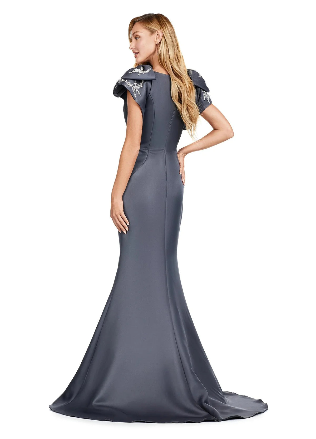 Back View -  Mermaid gown with structured ruffle shoulder details, a fitted silhouette, and a floor-length train for a timeless and sophisticated appearance.