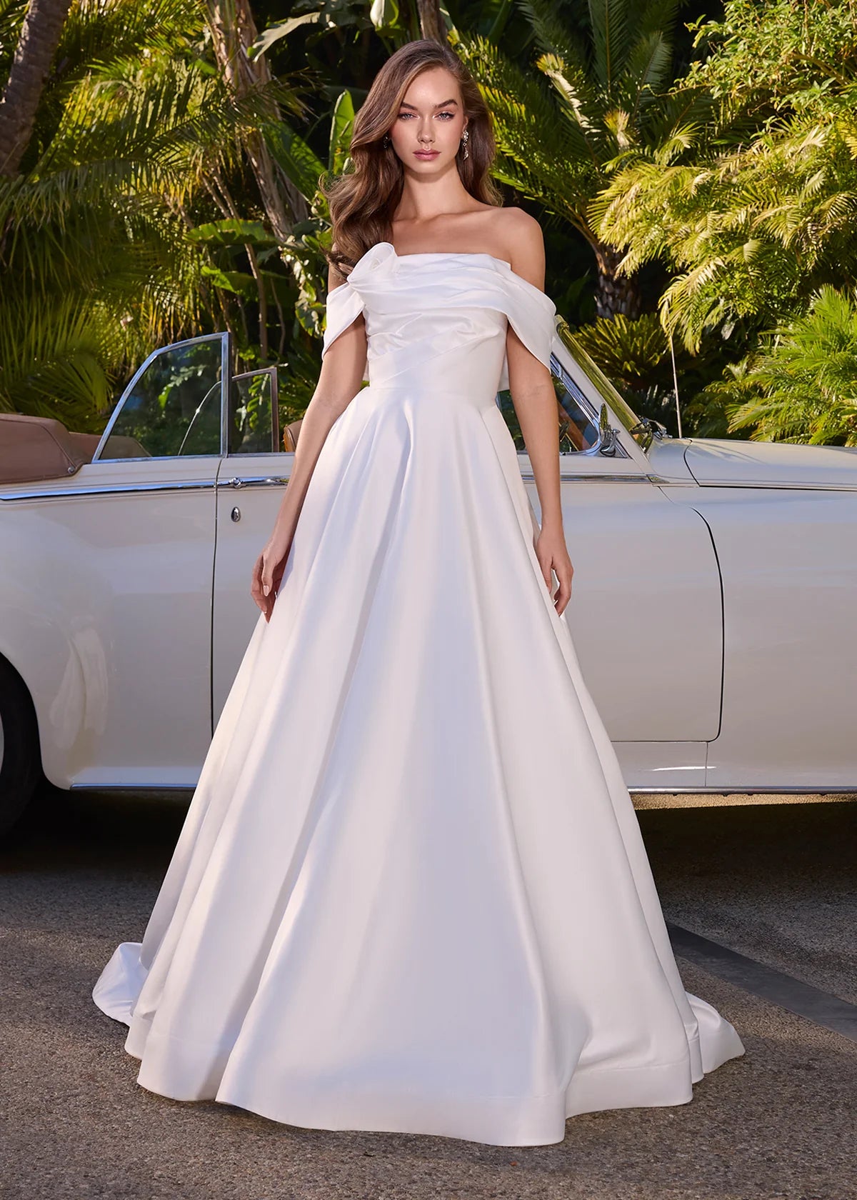 White ball gown featuring a structured bodice and a full satin skirt, perfect for formal occasions or a grand entrance.
