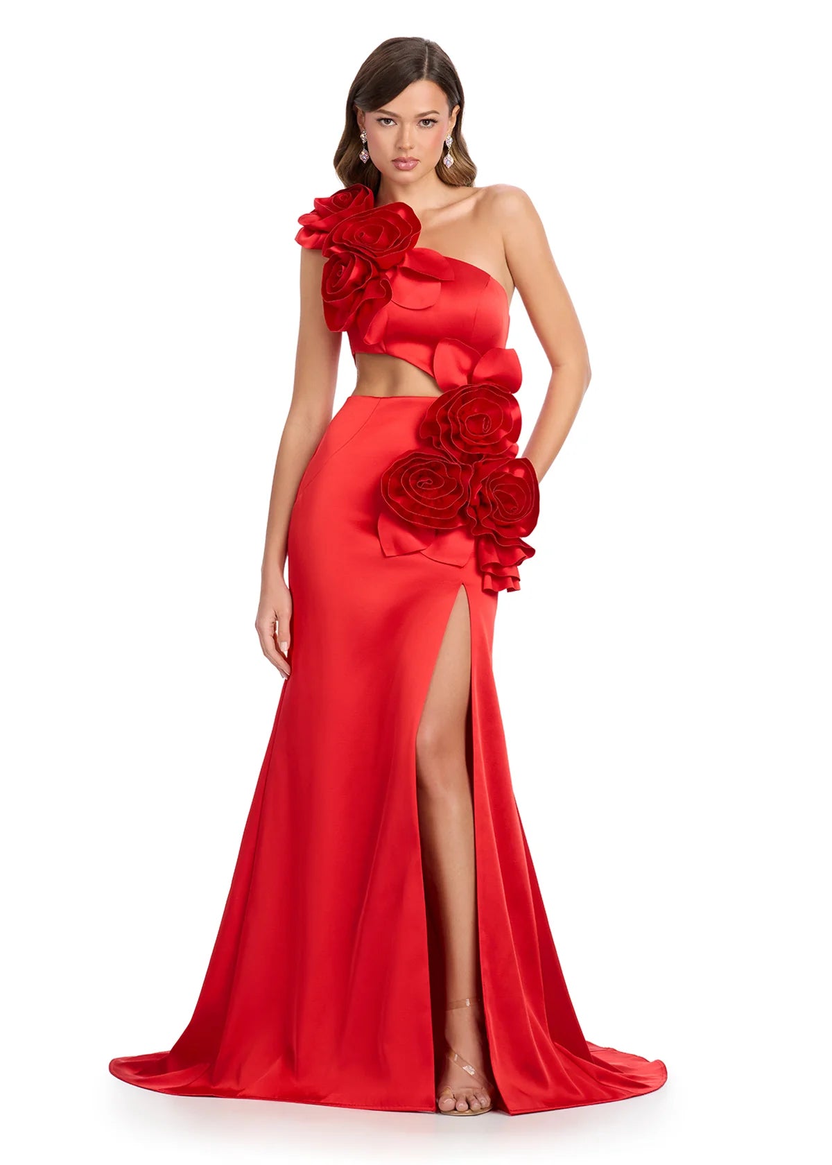 Red gown with an asymmetrical neckline, large rose accents, side cut-out, high slit, and a floor-length fitted silhouette.