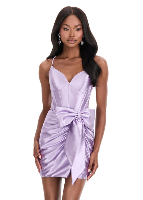 Orielle Mini Dress | Lilac satin corset mini dress with sweetheart neckline, ruched draping, and statement bow accent.
