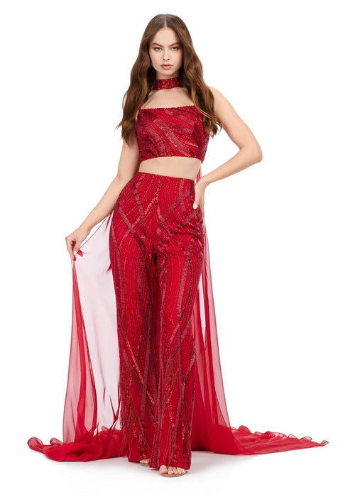 Aubrie Gown | Red beaded two-piece jumpsuit with spaghetti-strap bustier, matching choker and flowing chiffon cape for dramatic, modern look.
