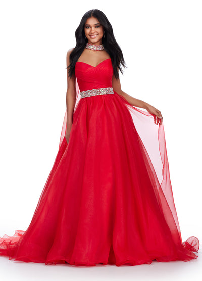 Video - Red ball gown featuring a sweetheart neckline, ruched bodice, sparkling embellished waistband, and a flowing tulle skirt for a fairytale-inspired look.