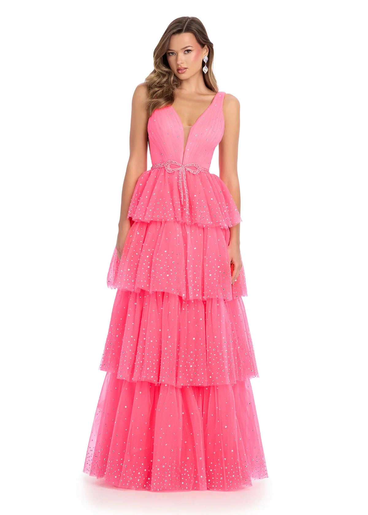 Video - Pink delicate tiered ball gown with a plunging neckline and a cinched waist, adorned with shimmering accents for an ethereal fairy-tale look.