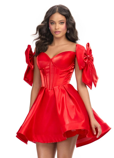 CLose up video of a striking red mini dress with a structured corset bodice, voluminous skirt, and oversized bow accents on the shoulders, perfect for a bold and playful statement look.