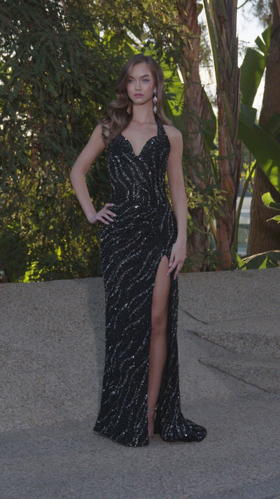Video - Black beaded halter gown featuring a plunging neckline, high leg slit, and intricate swirling embellishments, perfect for creating a bold and glamorous statement.
