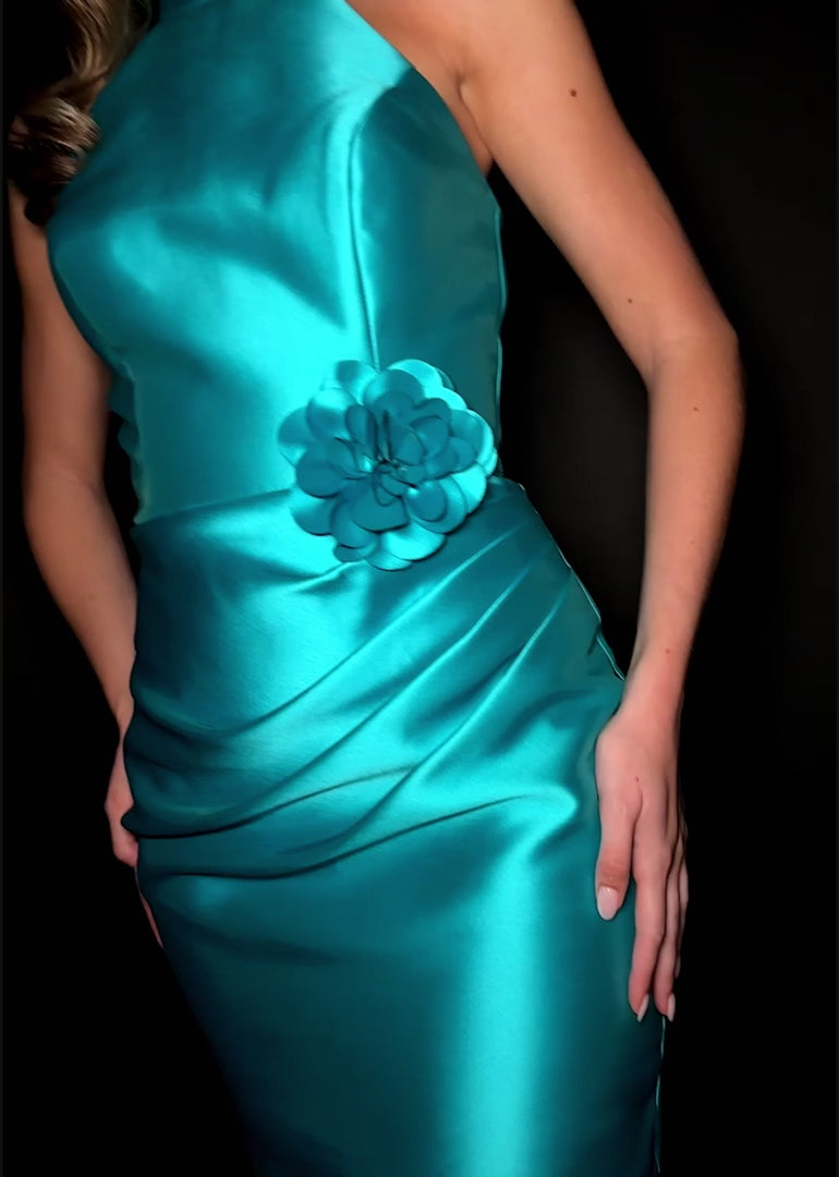 Video - Teal chic halter mini dress crafted from sleek satin fabric, featuring a floral accent at the waist and a flattering tailored fit.