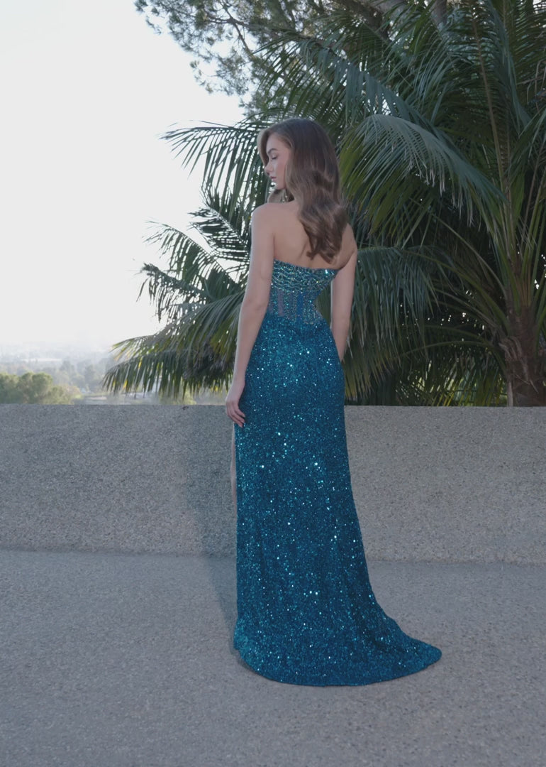 Video - Aqua gown with a sheer embellished bodice, fitted sparkling skirt, high slit, and floor-length design.