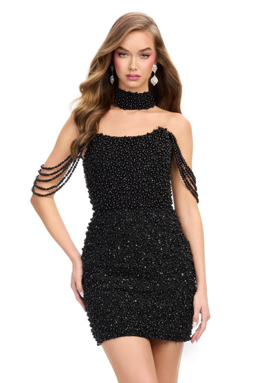 Close up video of a luxurious off-the-shoulder black mini dress adorned with pearl embellishments, featuring a choker neckline and elegant draped shoulder detailing.
