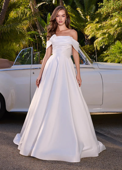Video of an elegant off-the-shoulder white ball gown featuring a structured bodice and a full satin skirt, perfect for formal occasions or a grand entrance.