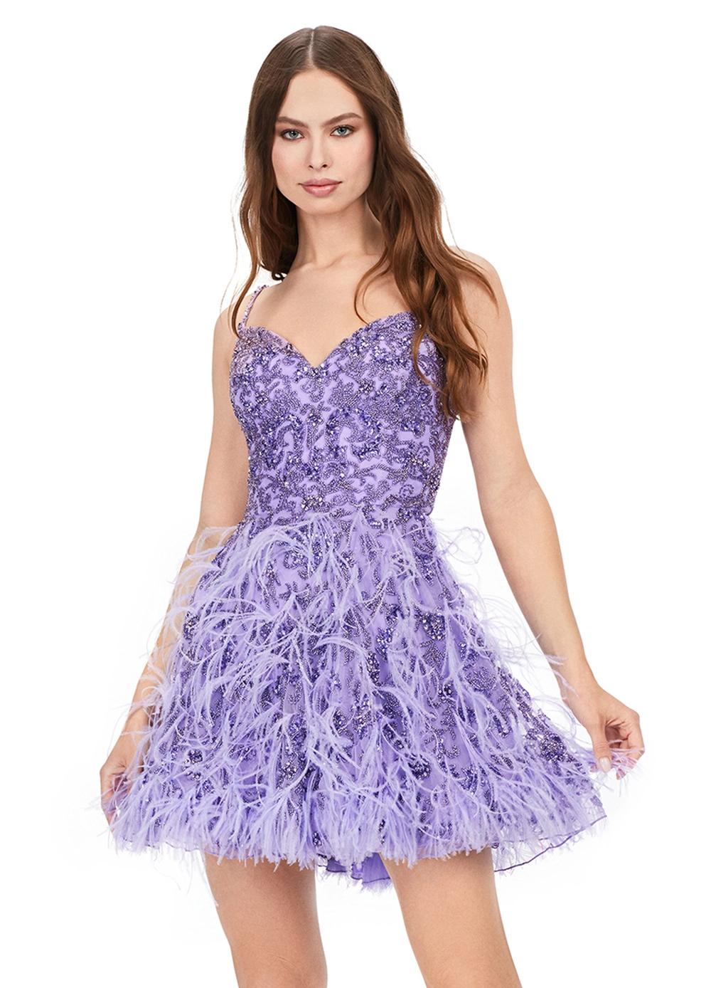 Video - Strapless purple mini dress featuring intricate beadwork on the bodice, a sweetheart neckline, and a feathered skirt for a playful yet elegant look.